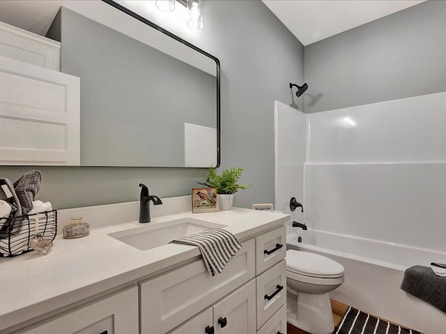 bathroom with toilet, bathtub / shower combination, and vanity