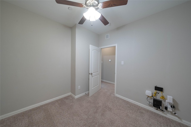 unfurnished bedroom with light colored carpet, visible vents, ceiling fan, and baseboards