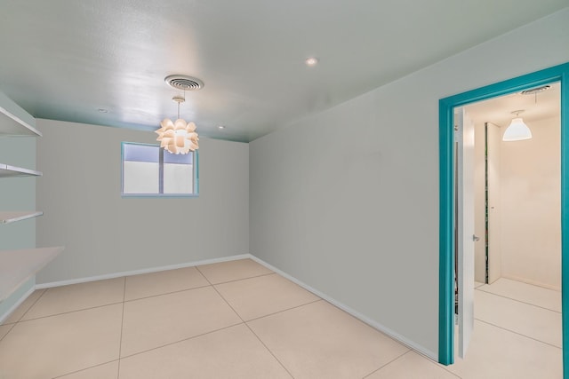 interior space with tile patterned floors and baseboards