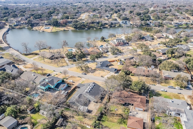aerial overview of property's location featuring a nearby body of water and nearby suburban area