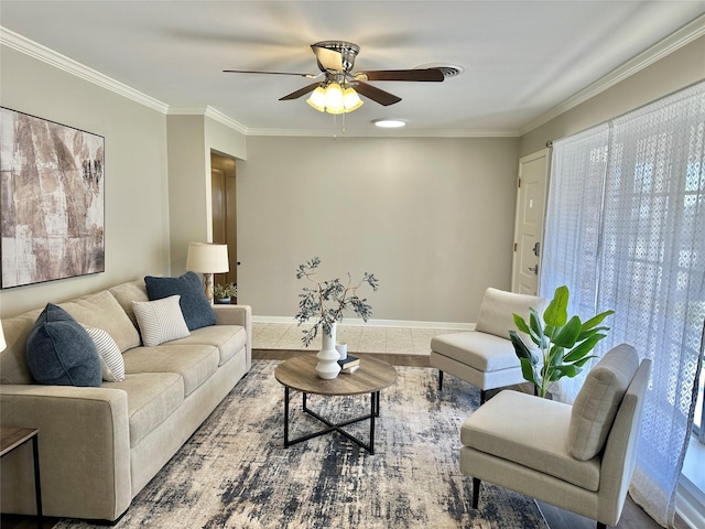 living room with a ceiling fan, baseboards, and crown molding