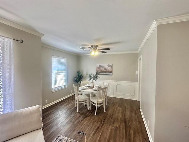 dining area with ceiling fan, baseboards, dark wood finished floors, and crown molding