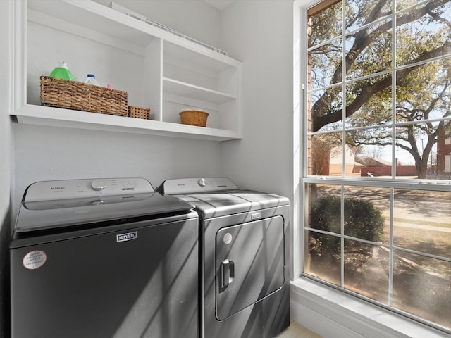 laundry area featuring independent washer and dryer and laundry area