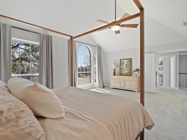 carpeted bedroom featuring visible vents, high vaulted ceiling, and ceiling fan