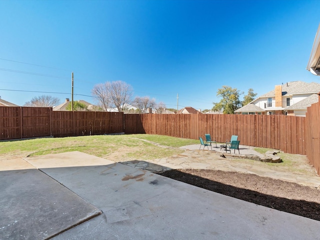 view of yard with a fenced backyard and a patio