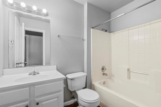 bathroom with toilet, vanity, and bathing tub / shower combination