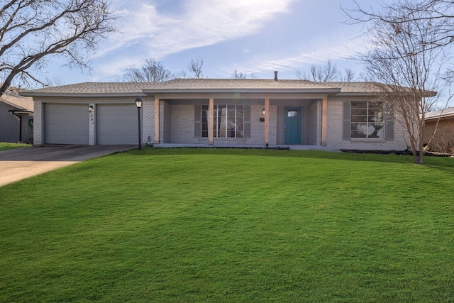ranch-style home featuring a porch, brick siding, driveway, a garage, and a front yard