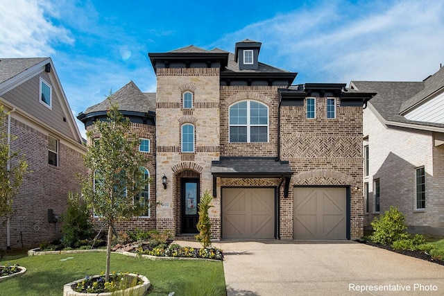 1231 Streamside Dr, Prosper, TX 75078 - french country style house with concrete driveway, brick siding, an attached garage, a front lawn, and roof with shingles