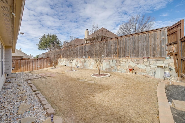 view of yard with a fenced backyard