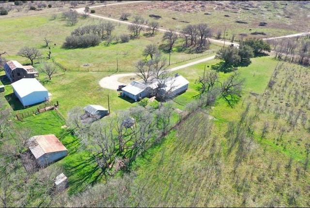 birds eye view of property with a rural view