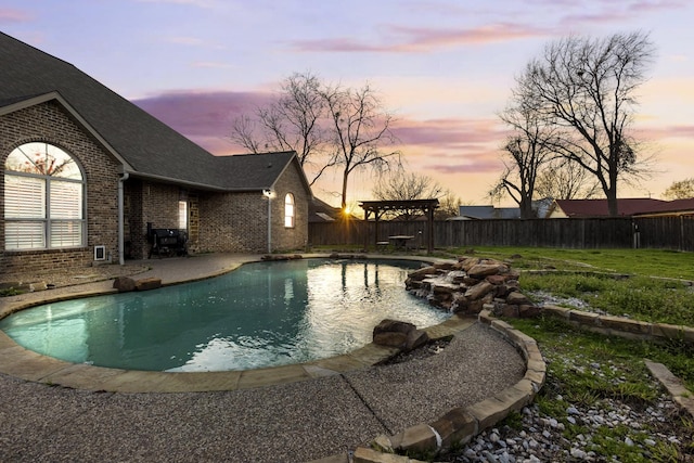 view of pool featuring a fenced backyard, a fenced in pool, and a pergola