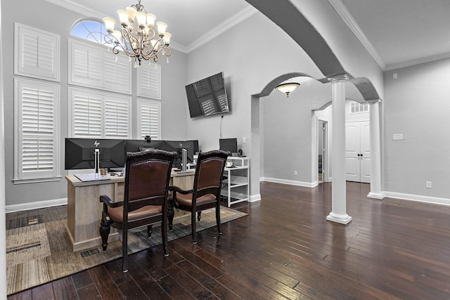 office featuring decorative columns, arched walkways, dark wood-type flooring, and ornamental molding