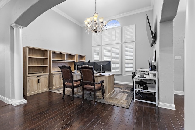 office area with dark wood-type flooring, arched walkways, crown molding, and decorative columns