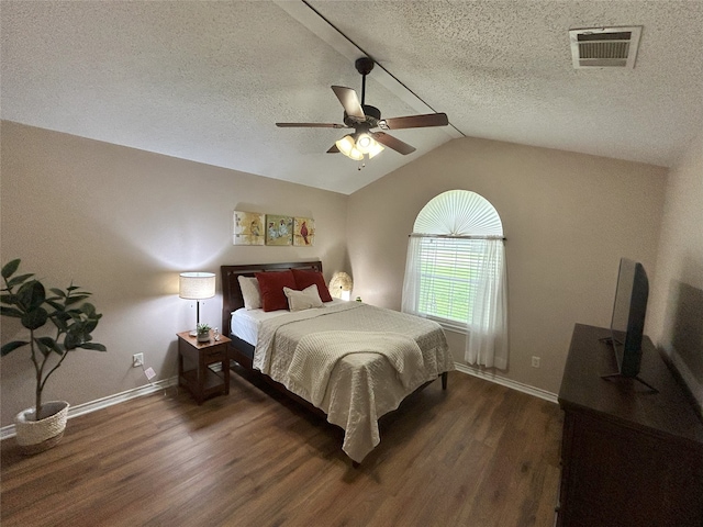 122 Lakeway Ln, Gun Barrel City, TX 75156 - bedroom with wood finished floors, a textured ceiling, lofted ceiling, a ceiling fan, and baseboards