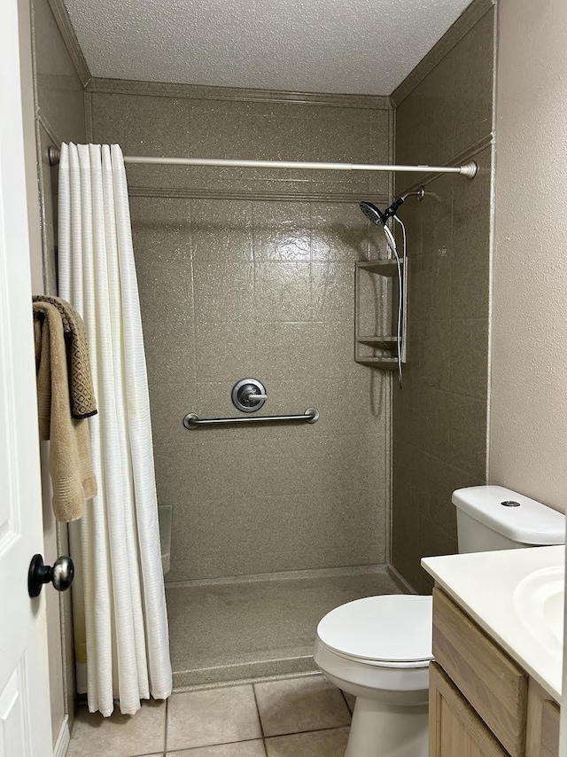 122 Lakeway Ln, Gun Barrel City, TX 75156 - full bath featuring a shower stall, toilet, tile patterned flooring, vanity, and a textured ceiling