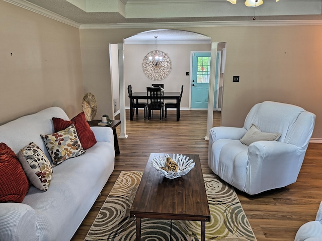 122 Lakeway Ln, Gun Barrel City, TX 75156 - living area featuring arched walkways, a chandelier, wood finished floors, crown molding, and baseboards