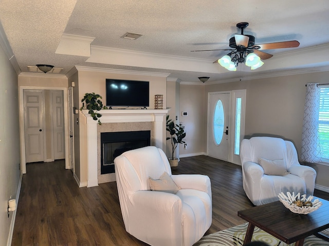 122 Lakeway Ln, Gun Barrel City, TX 75156 - living room with ceiling fan, dark wood-style flooring, a fireplace, ornamental molding, and baseboards