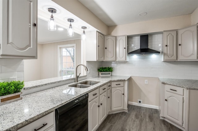 kitchen featuring a sink, wall chimney range hood, decorative backsplash, dishwasher, and decorative light fixtures