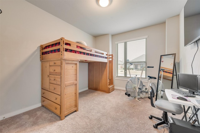 bedroom with carpet and baseboards