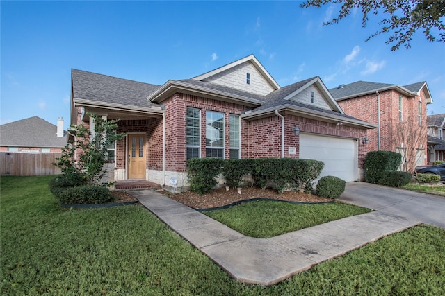 view of front of home featuring brick siding, concrete driveway, an attached garage, a front yard, and fence