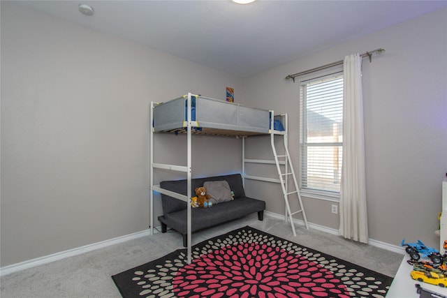 carpeted bedroom with baseboards