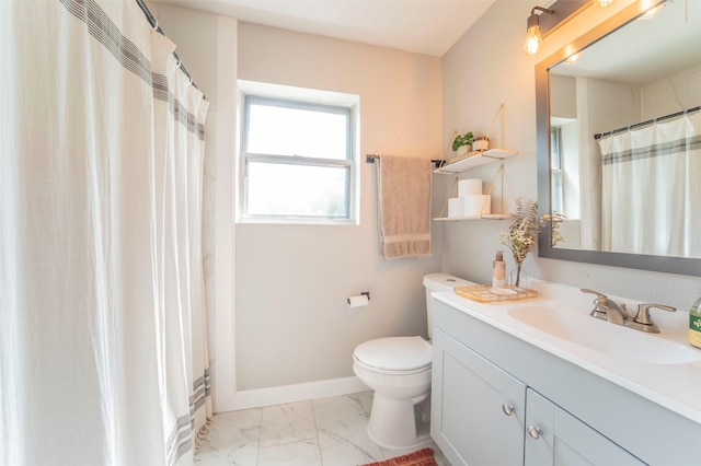 full bath featuring marble finish floor, toilet, vanity, and baseboards