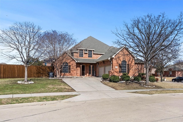 view of front of property with concrete driveway, roof with shingles, an attached garage, fence, and brick siding