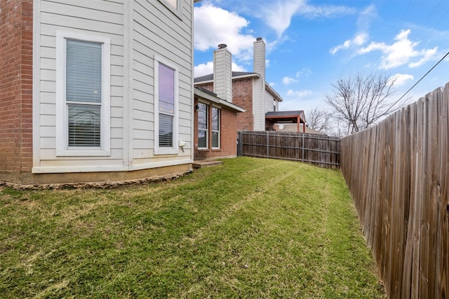 view of yard featuring a fenced backyard