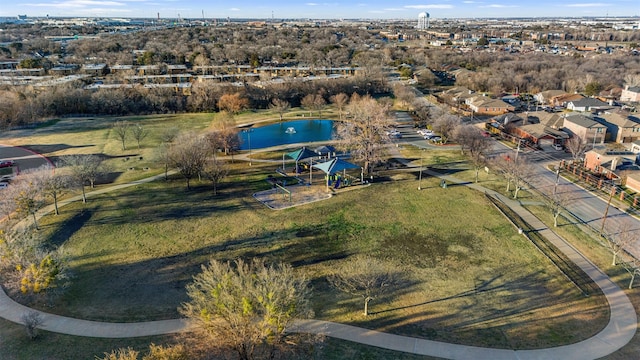 drone / aerial view featuring a water view and a residential view