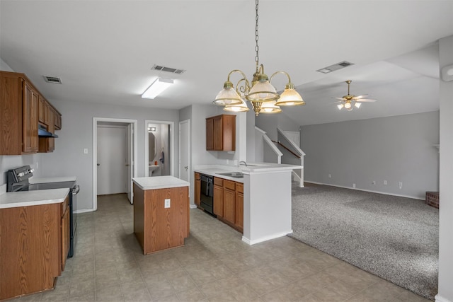 kitchen with a center island, brown cabinets, light countertops, open floor plan, and black appliances