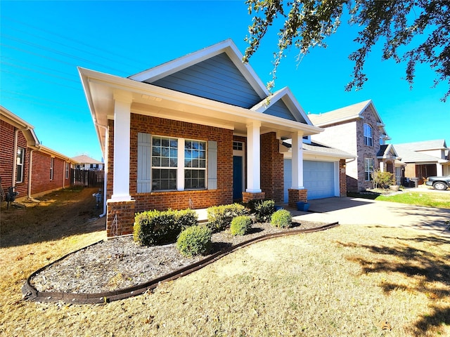 view of front of house featuring a garage, driveway, and brick siding