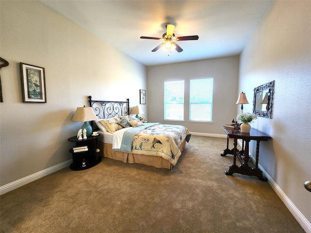 bedroom featuring baseboards, dark colored carpet, and a ceiling fan