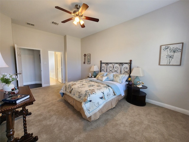 bedroom with light carpet, visible vents, and baseboards