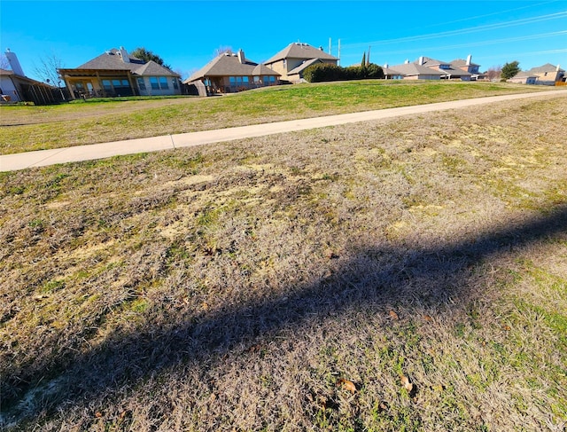 view of yard featuring a residential view