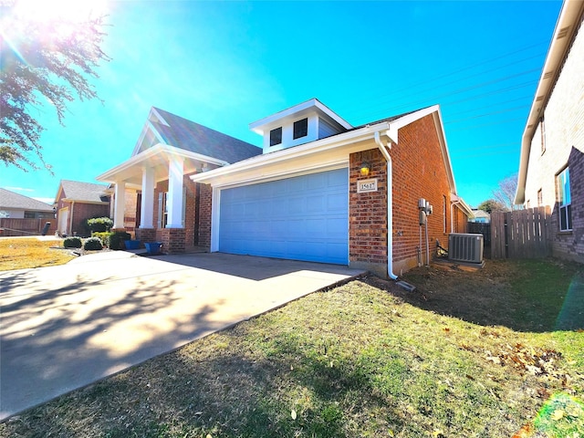 view of front of house with brick siding, central AC, fence, driveway, and a front lawn