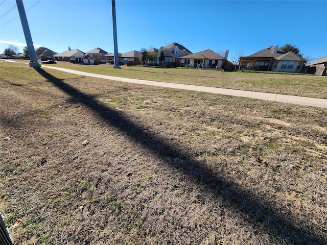 view of yard featuring a residential view