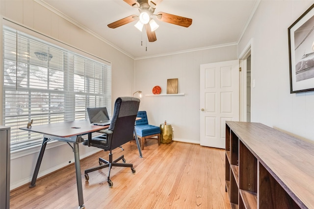 home office featuring light wood-style floors, ceiling fan, and crown molding