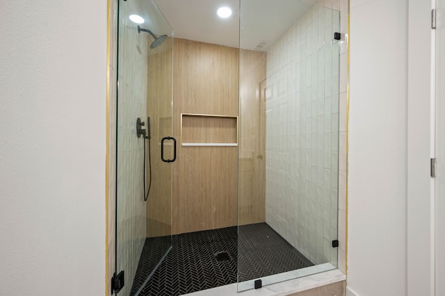 bathroom featuring a shower stall