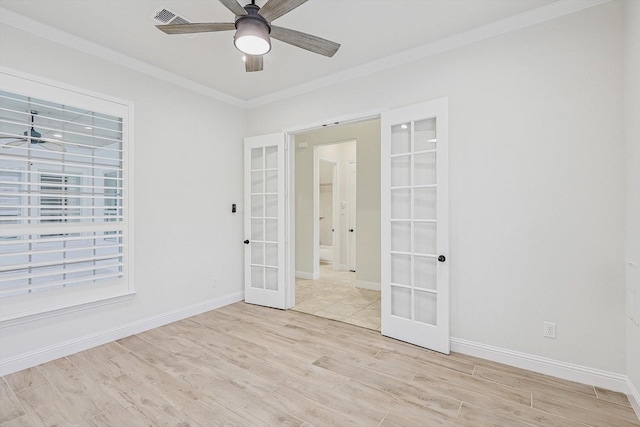 unfurnished room featuring ceiling fan, french doors, and light wood finished floors