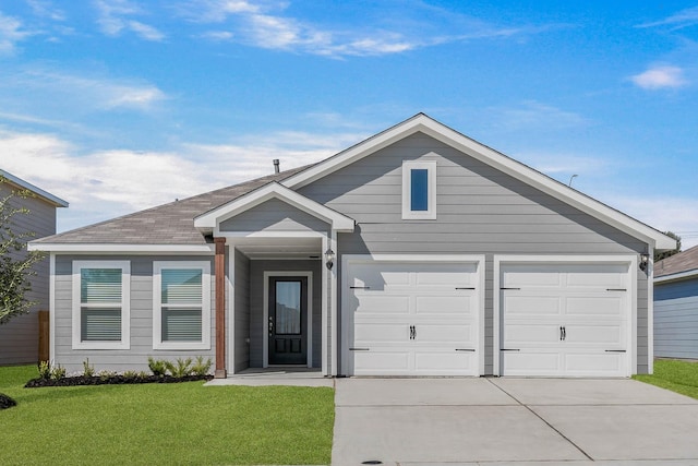 ranch-style house with a garage, roof with shingles, concrete driveway, and a front yard