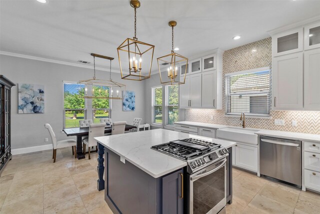 kitchen featuring stainless steel appliances, a center island, glass insert cabinets, and white cabinets