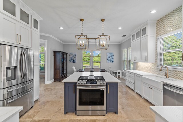 kitchen featuring glass insert cabinets, a kitchen island, white cabinetry, and a sink