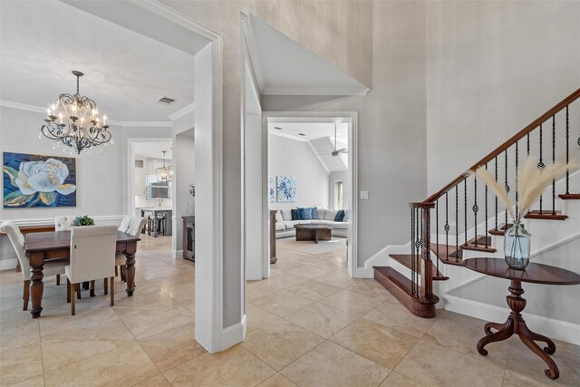 living room featuring recessed lighting, visible vents, crown molding, and a stone fireplace