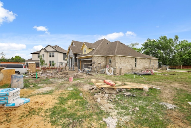 6306 Marlbourough Ct, Garland, TX 75043 - back of property featuring a shingled roof and brick siding