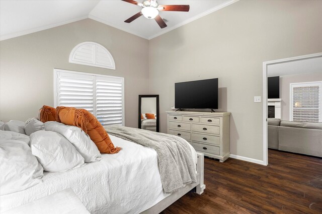 bedroom featuring baseboards, lofted ceiling, dark wood-style floors, ceiling fan, and a fireplace