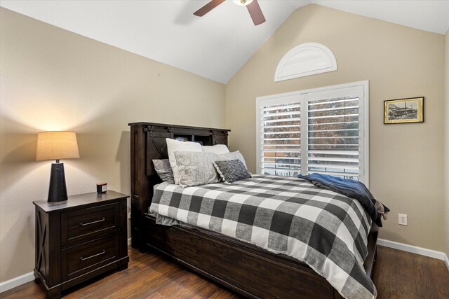 bedroom featuring lofted ceiling, ceiling fan, baseboards, and dark wood-style flooring