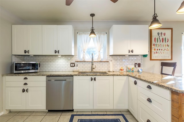 kitchen with a sink, white cabinetry, and stainless steel dishwasher