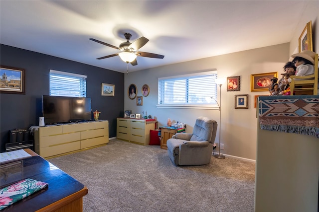 carpeted bedroom featuring ceiling fan, multiple windows, and baseboards