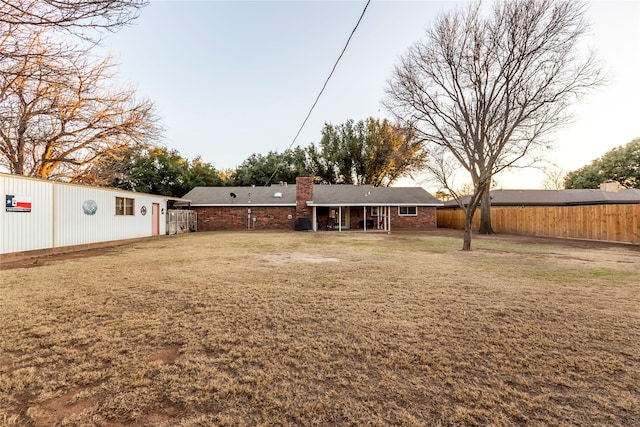 view of yard with a fenced backyard