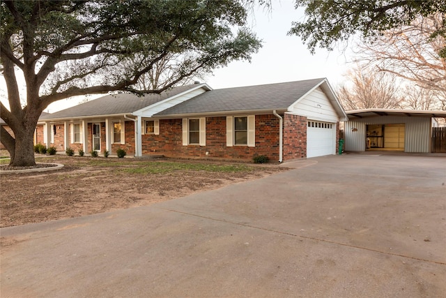 ranch-style home featuring a garage, concrete driveway, and brick siding